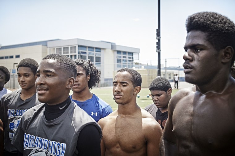 Students attend football practice at Oakland High School in Oakland, California.