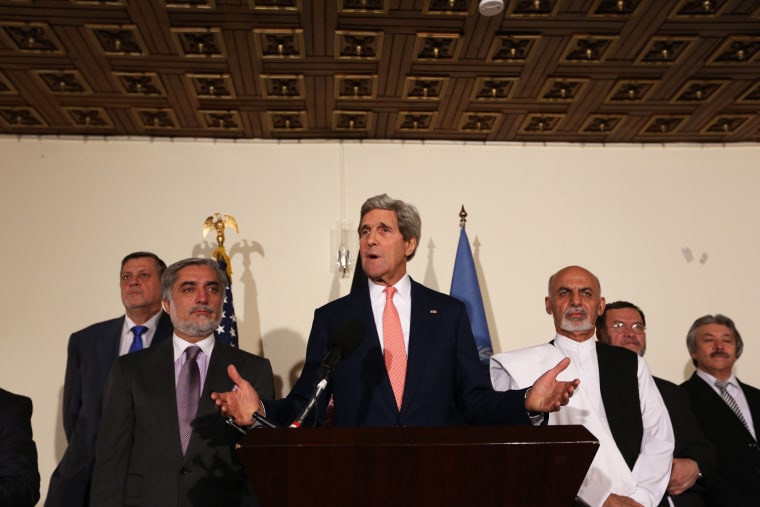 U.S. Secretary of State John Kerry, center, Afghan presidential candidate Abdullah Abdullah, left, and Afghanistan's presidential candidate Ashraf Ghani Ahmadzai, right, speaks during a joint press conference in Kabul, Afghanistan, July 12, 2014.