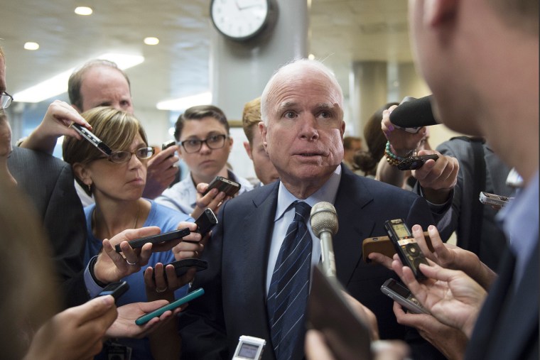Senator John McCain , R-Ariz., talks to reporters after a closed meeting on Capitol Hill in Washington, D.C., July 8, 2014.