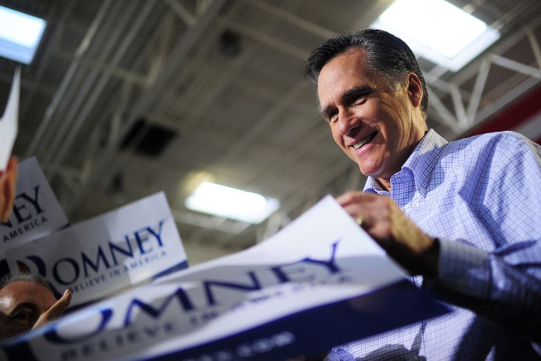 Former Republican presidential nominee Mitt Romney greets supporters as he holds a campaign rally  in Jacksonville, Fla., on Jan. 30, 2012.