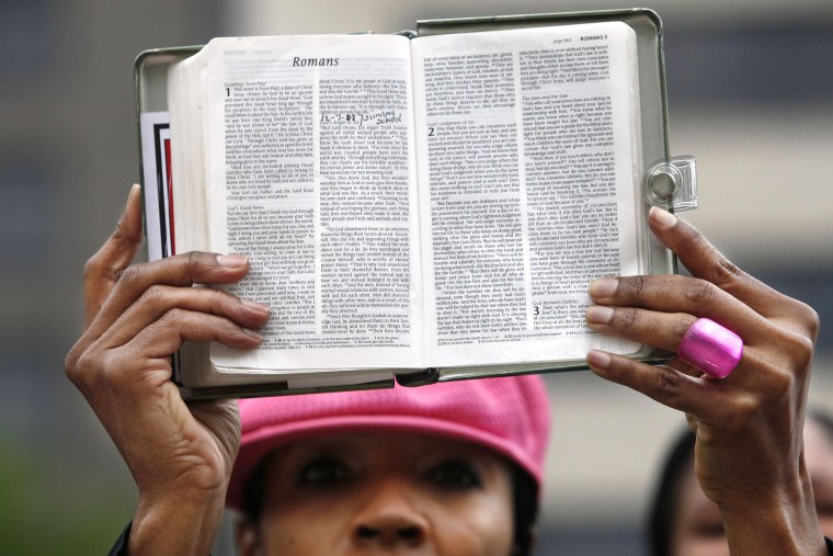 Brenda Buckner, of Lakeridge, Va., holds up a bible in Washington, on May 5, 2009.