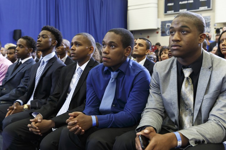 A group of young men listen as President Barack Obama speaks about the My Brother's Keeper Initiative, at the Walker Jones Education Campus in Washington, D.C., July 21, 2014.