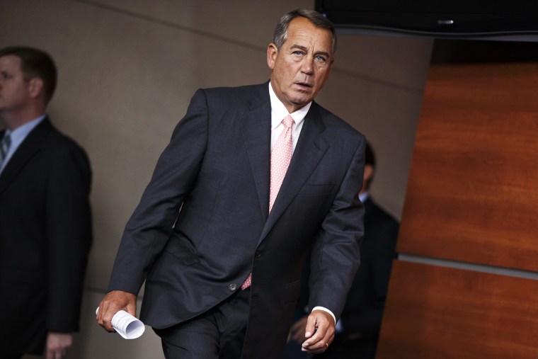 John Boehner arrives for a news conference on Capitol Hill in Washington, July 17, 2014.