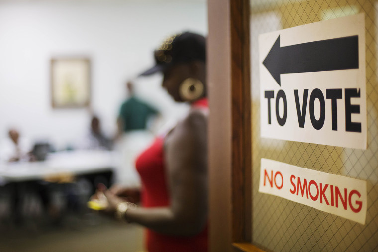 A sign directs voters at a polling site, on July 22, 2014, in Atlanta.