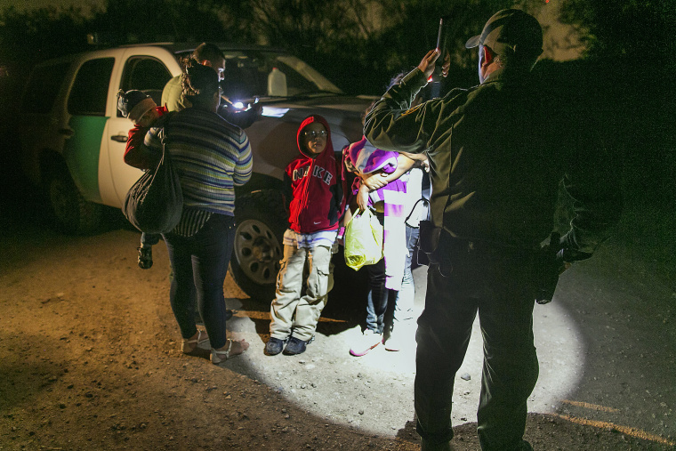 Mothers from Honduras traveling with their children prepare to get into a U.S. Customs and Border Protection Services agent's truck after crossing the Rio Grande near McAllen, Texas, July 3, 2014.