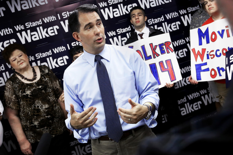 Wisconsin Gov. Scott Walker addresses members of the media during a stop at the Madison GOP field office in Madison, Wis., Wednesday, July 23, 2014.