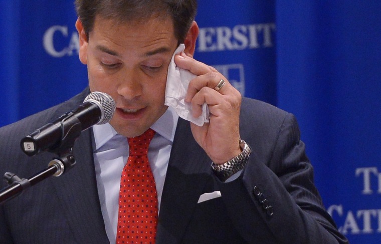 Senator Marco Rubio, R-FL, wipes his brow as he speaks during a discussion on the American family and cultural values.\" at Catholic University on July 23, 2014 in Washington, D.C.
