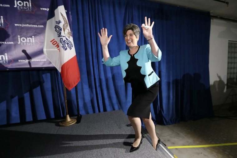State Sen. Joni Ernst waves to supporters at a primary election night rally in Des Moines, Iowa, June 3, 2014.