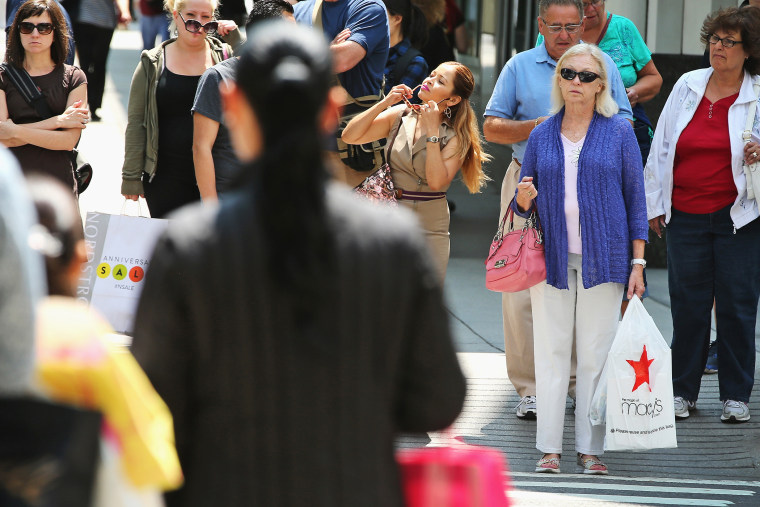 Shoppers visit stores along a section of Michigan Avenue on July 29, 2014 in Chicago, Illinois.