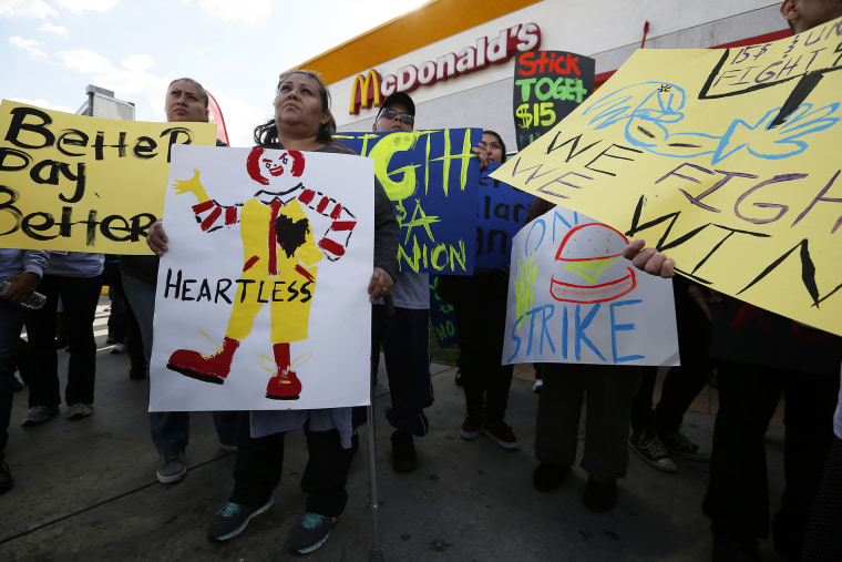 Protesters gather outside McDonald's in Los Angeles, California, December 5, 2013.
