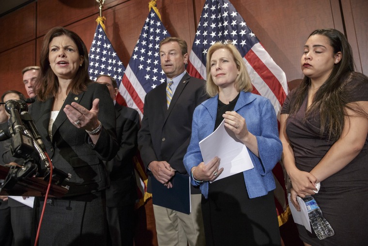 From left, Sen. Kelly Ayotte, R-N.H., Sen. Dean Heller, R-Nev., Sen. Kirsten Gillibrand, D-N.Y., and Anna, a survivor of sexual assault, appear at a news conference on Capitol Hill in Washington, D.C., July 30, 2014, to discuss \"Campus Accountability and