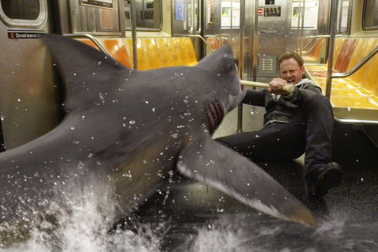 In this image released by Syfy, Ian Ziering, as Fin Shepard battles a shark on a New York City subway in a scene from \"Sharknado 2: The Second One.