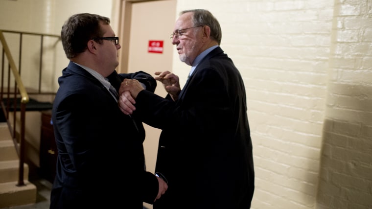 Rep. Don Young, R-Alaska, confronts an aide who tried to stop him from entering the side door of a House Republican meeting in the Capitol, July 31, 2014.