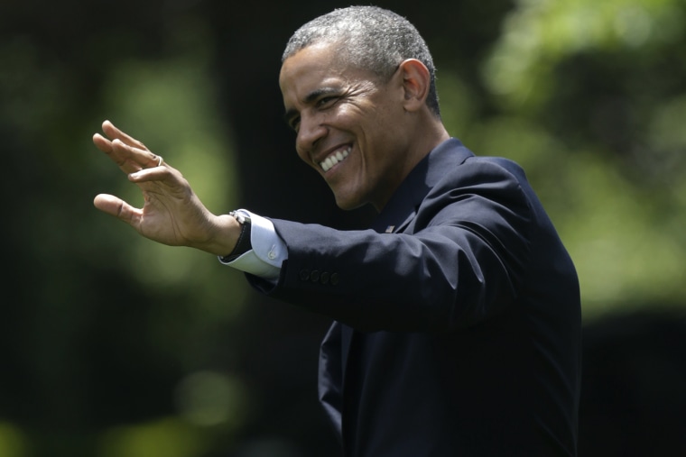 United States President Obama waves as he departs the White House on the South Lawn in Washington