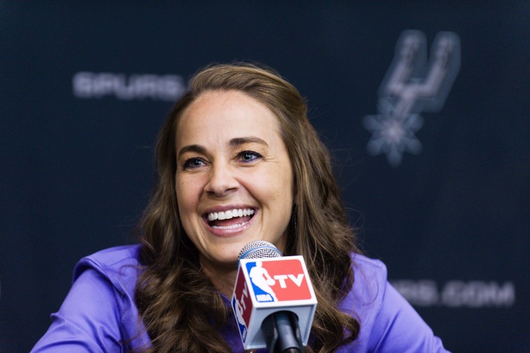 WNBA star Becky Hammon takes questions from the media at the San Antonio Spurs practice facility after being introduced as an assistant coach with the team, Aug. 5, 2014.