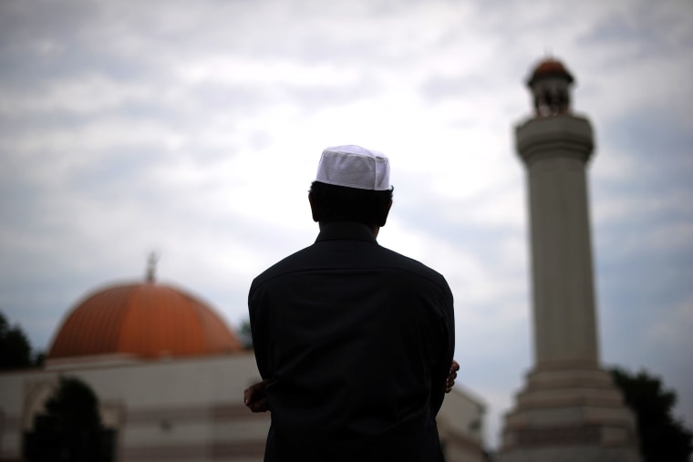 A Muslim takes part in a special morning prayer to start Eid-al-Fitr festival, marking the end of their holy fasting month of Ramadan.