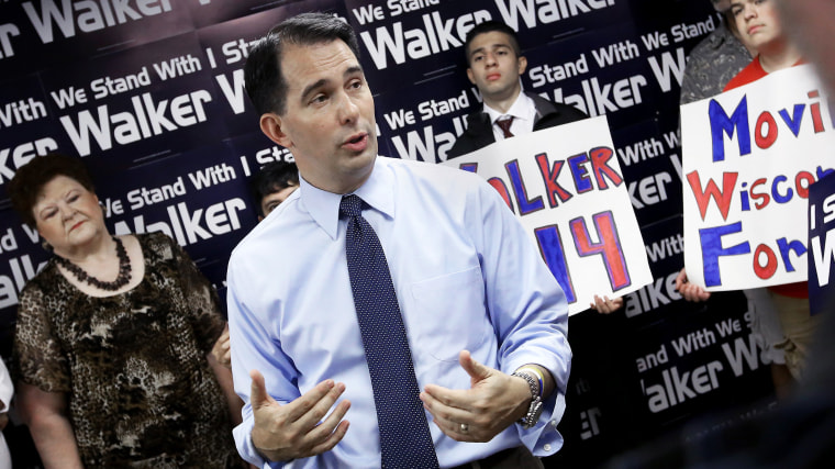 Wisconsin Gov. Scott Walker addresses members of the media and volunteers with the state's Republican Party during a stop at the Madison GOP field office in Madison, Wis., Wednesday, July 23, 2014.