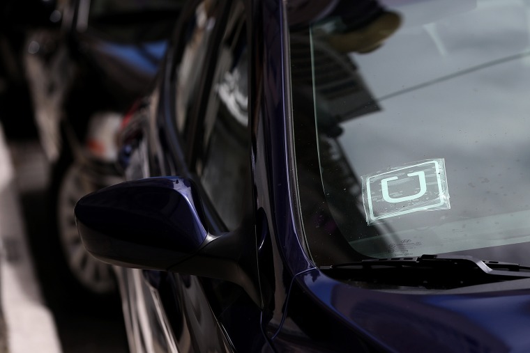 A sticker with the Uber logo is displayed in the window of a car on June 12, 2014 in San Francisco, Calif.