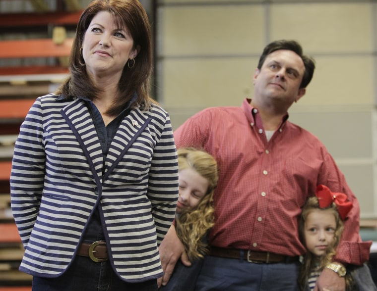 Wisconsin Lt. Gov. Rebecca Kleefisch and her family wait for their introduction at a campaign rally for Kleefisch and Gov. Scott Walker in Dane, Wis., April 15, 2014.