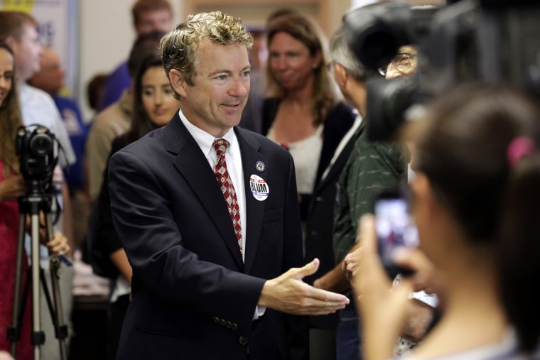 Sen. Rand Paul, R-Ky. is greeted by local Republicans before speaking at a gathering for local candidates, Aug. 5, 2014, in Hiawatha, Iowa.