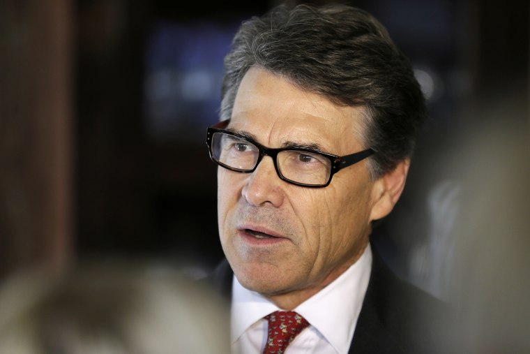 Texas Gov. Rick Perry speaks to reporters following a fund-raising breakfast for Iowa Gov. Terry Branstad, May 29, 2014, in Ames, Iowa.