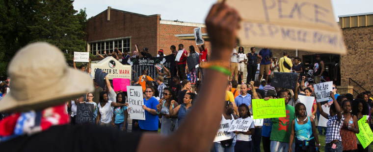 Demonstrators protest outside of Greater St. Marks Family Church in Ferguson, Missouri