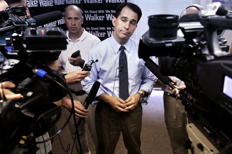 Wisconsin Governor Scott Walker addresses members of the media in Madison, Wis., July 22, 2014.