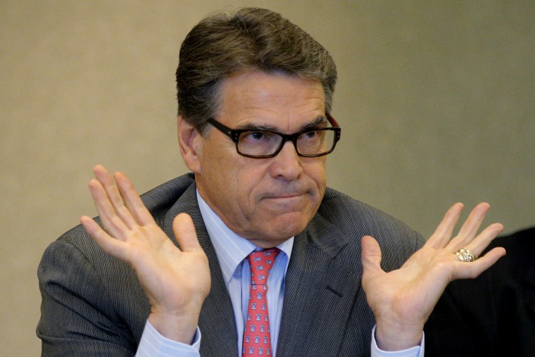 Texas Governor Perry answers question about indictment in Texas on two felony counts of abuse of power during appearance at business leaders luncheon in Portsmouth