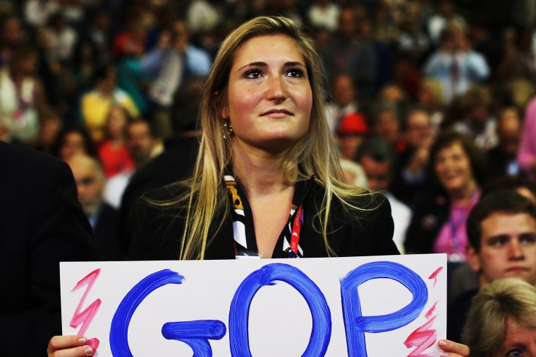 A woman holds a handmade campaign sign during the 2012 RNC on August 29, 2012 in Tampa, Florida.