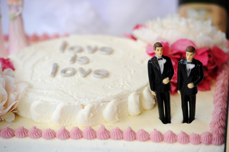 A wedding cake with a male couple is seen at a same-sex marriage celebration, July 1 2013.