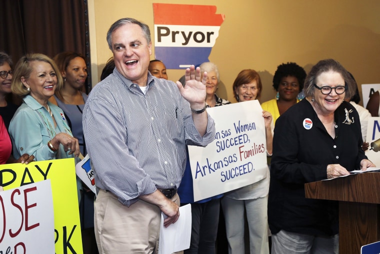 Sen. Mark Pryor, D-Ark., left, is introduced to a group of women supporters at a rally in Little Rock, Ark., Thursday, Aug. 28, 2014.