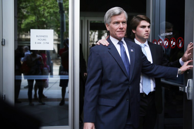 Former Virginia Governor Robert McDonnell (L) leaves U.S. District Court for the Eastern District of Virginia with his son Bobby (R) after jury began their deliberations on his corruption trial Sept. 2, 2014, 2014 in Richmond, Va.