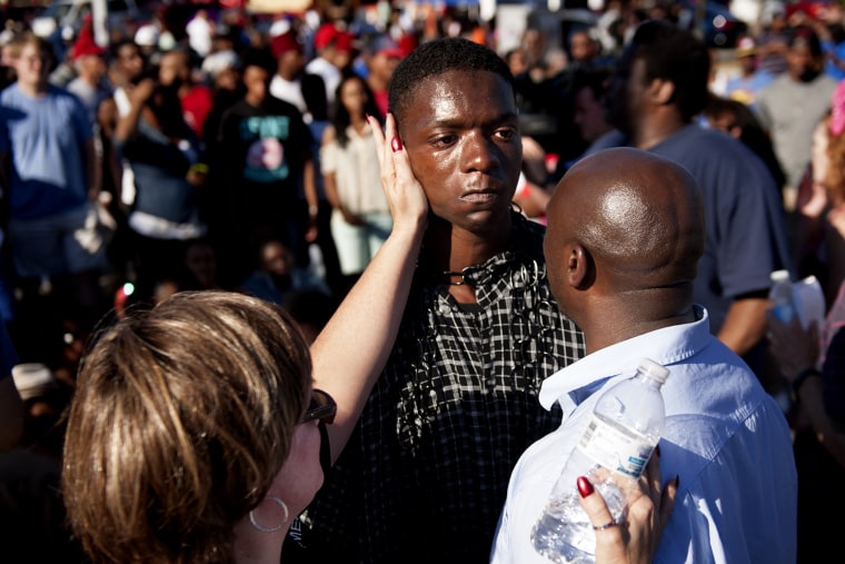 The Rev. Willis Johnson (right) confronts 18-year-old Joshua Williams as protesters defy police and block traffic in Ferguson, Mo. on Aug. 13, 2014. (Sid Hastings/The Washington Post/Getty)