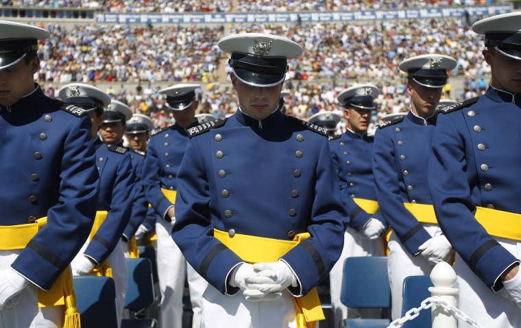 U.S. Air Force Academy Cadets of the Class of 2012, lower their heads during the Invocation at the start of the commencement ceremony, Wednesday, May 23, 2012, in Colorado Springs, Colo.