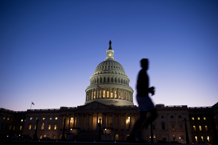 A man jogs past the U.S. Capitol in Washington, D.C., on Sept. 30, 2013.
