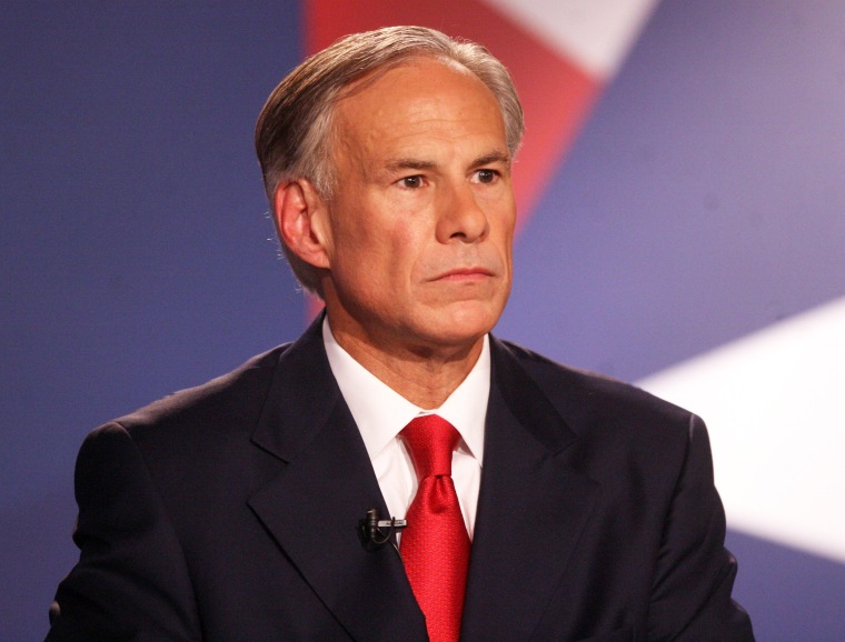 Texas Attorney General Greg Abbott reacts to comments made by Texas state Sen. Wendy Davis during the Rio Grande Valley Gubernatorial Debate in Edinburg,...