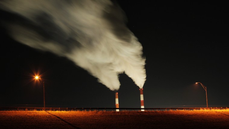 In this Jan. 19, 2012 file photo, smoke rises in this time exposure image from the stacks of a coal-fired power plant in La Cygne, Kan. (Photo by Charlie Riedel/AP)