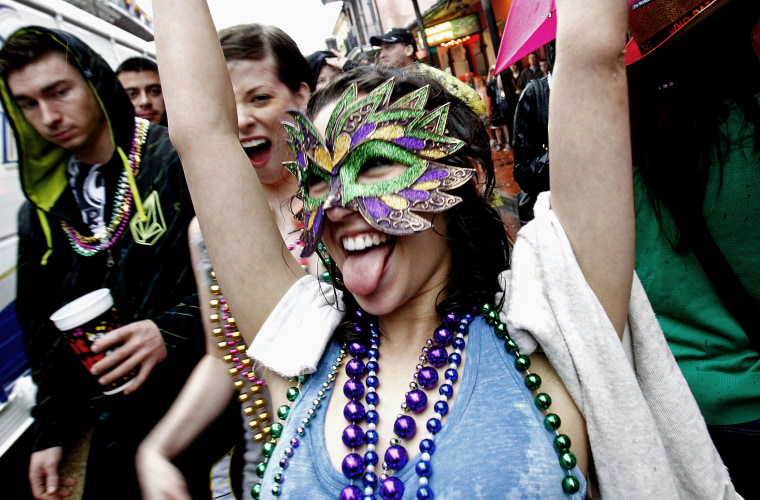 Revelers celebrate Mardi Gras on the streets of the French Quarter in New Orleans on March 5, 2011.