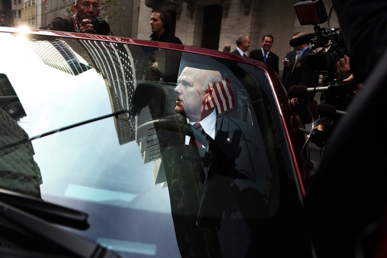 General Motors CEO Dan Akerson sits in a GM car in front of the New York Stock Exchange as GM returns to the US stock market on November 18, 2010 in New York, City.