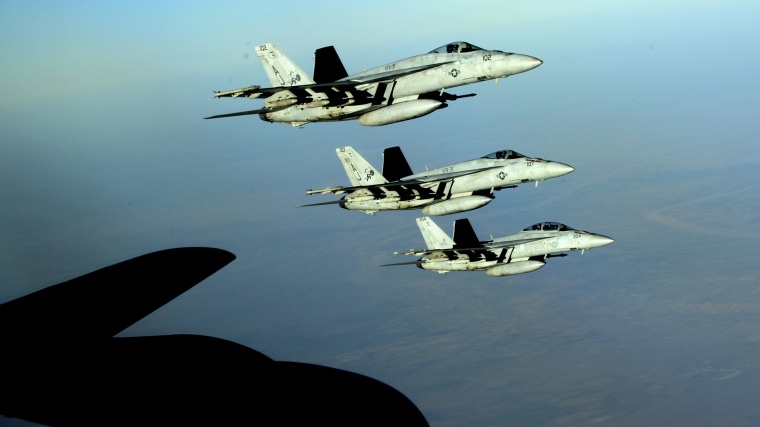 A formation of U.S. Navy F-18E Super Hornets leaves after receiving fuel from a KC-135 Stratotanker over northern Iraq on Sept. 23, 2014.