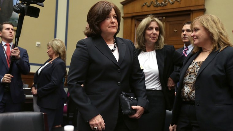 Secret Service Director Julia Pierson (C) arrives to testify to the House Oversight and Government Reform Committee on the White House perimeter breach at the Rayburn House Office Building on Sept. 30, 2014 in Washington, DC.