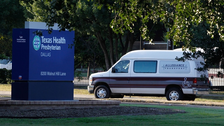 A medical transport van moves past Texas Health Presbyterian Hospital Dallas where a patient has been diagnosed with the Ebola virus on Sept. 30, 2014 in Dallas, Texas. (Photo by Mike Stone/Getty)