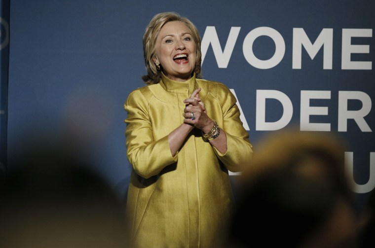 Former U.S. Secretary of State Clinton reacts to the cheers of the crowd as she arrives to address the DNC Women?s Leadership Forum?s annual Issues Conference in Washington
