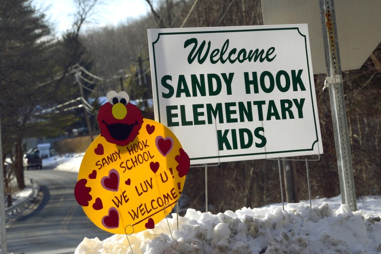 A sign welcoming children from Sandy Hook Elementry school sits on the road in Monroe, Connecticut on Jan. 3, 2013.