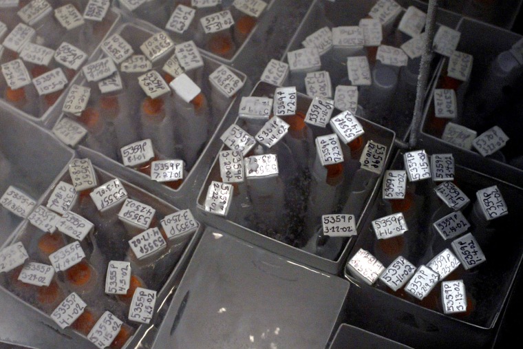 Sperm samples, each individually numbered, rest in a tank of liquid nitrogen at California Cryobank headquarters in Los Angeles.