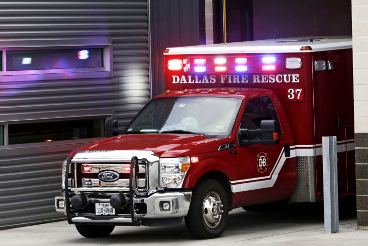 An ambulance pulls into the Dallas Fire-Rescue station 37 in Dallas, Wednesday, Oct. 1, 2014.