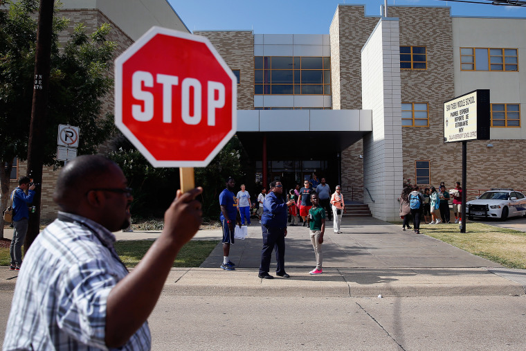 Students are dismissed from Sam Tasby Middle School on October 1, 2014 in Dallas, Texas. Officials confirmed that a student, who had contact with the first confirmed Ebola virus patient in the United States, attends classes at the school.