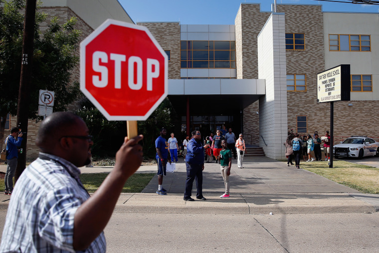 Students are dismissed from Sam Tasby Middle School on Oct. 1, 2014 in Dallas, Texas. Officials confirmed that a student, who had contact with the first confirmed Ebola virus patient in the United States, attends classes at the school.