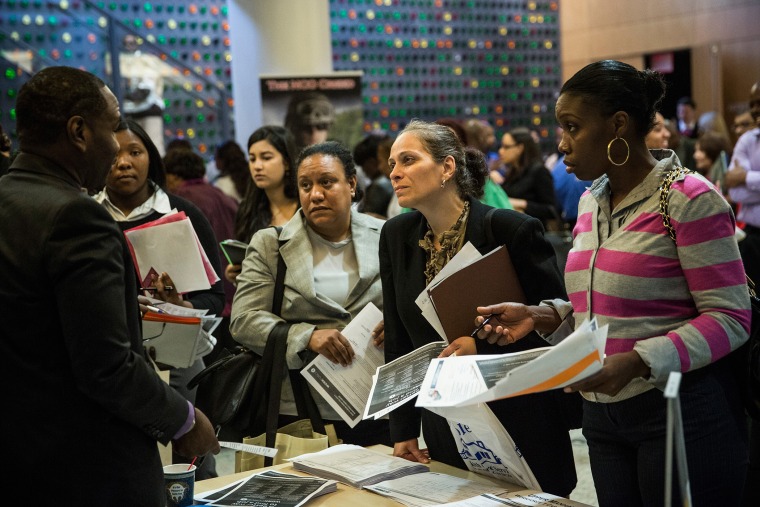 People attend a jobs fair at the Bronx Public Library on Sept. 17, 2014 in New York City.