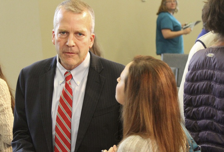 Dan Sullivan, Republican candidate for U.S. Senator, left, speaks with supporters following a debate Monday, Aug. 4, 2014, in Eagle River, Alaska. The winner...